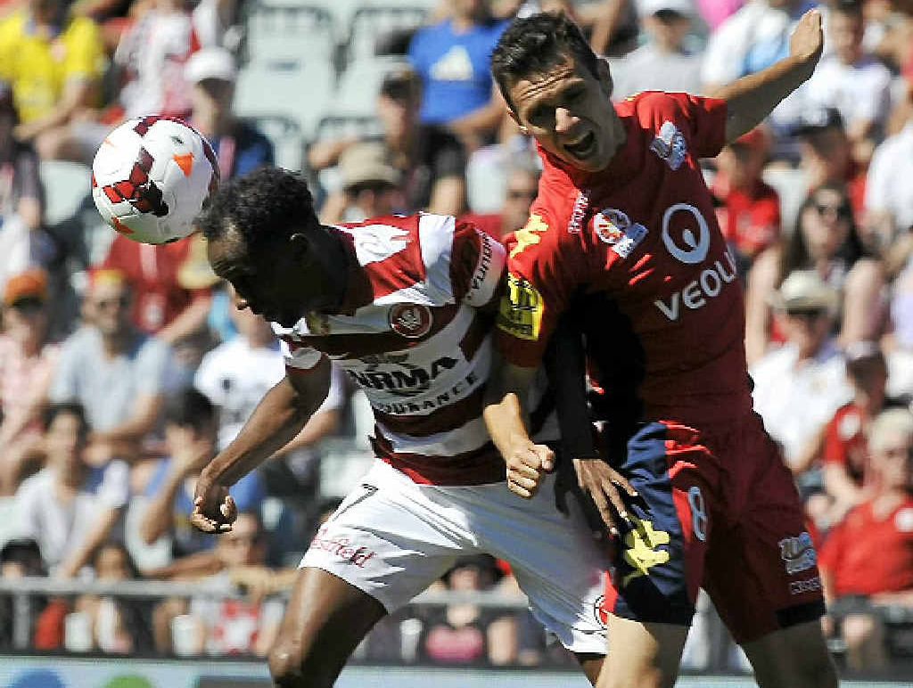 HEADS UP: Western Sydney’s Youssouf Hersi (left) and Adelaide’s Isaias clash during yesterday’s A-League match at Coopers Stadium in Adelaide. HEADS UP: Western Sydney’s Youssouf Hersi (left) and Adelaide’s Isaias clash during yesterday’s A-League match at Coopers Stadium in Adelaide.